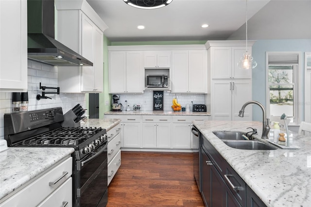 kitchen with white cabinetry, dark wood-type flooring, black appliances, wall chimney exhaust hood, and pendant lighting