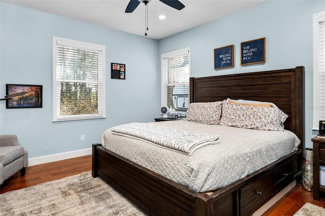 bedroom featuring ceiling fan and dark hardwood / wood-style flooring