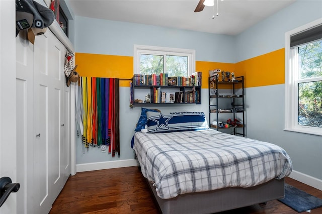 bedroom featuring ceiling fan and dark wood-type flooring