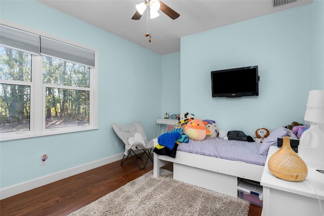 bedroom featuring ceiling fan and dark hardwood / wood-style flooring