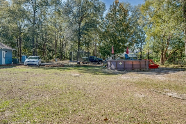 view of yard featuring a trampoline