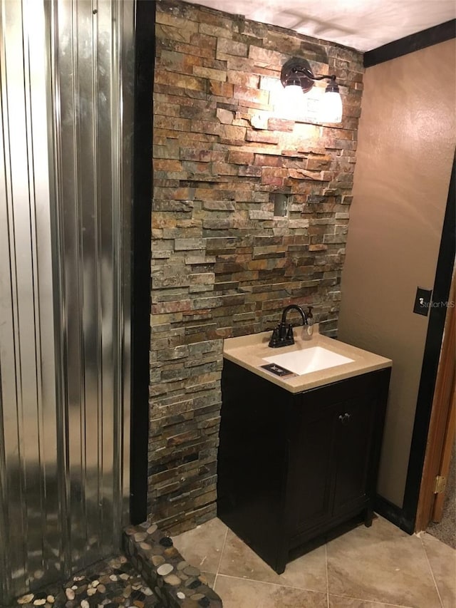 bathroom with tile flooring and vanity