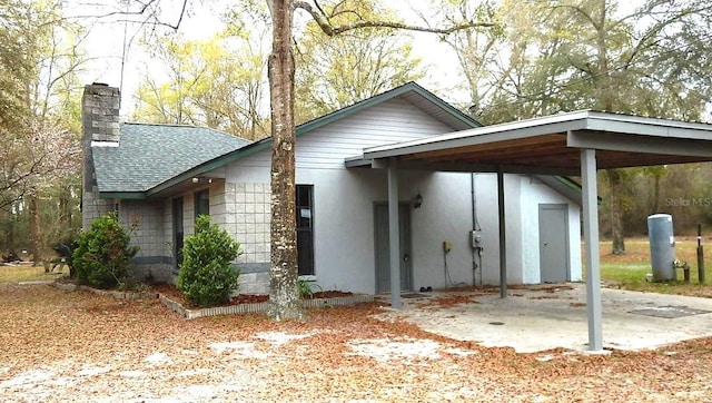 view of front of property with a carport