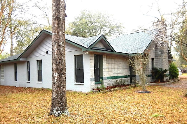 view of property exterior featuring a yard