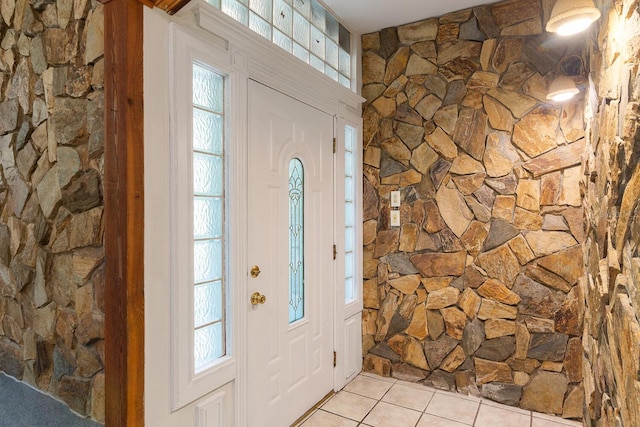 entryway featuring light tile patterned floors