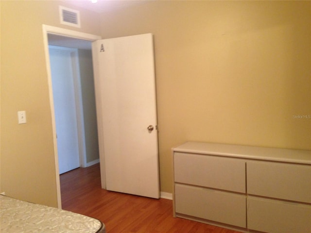 unfurnished bedroom with light wood-type flooring