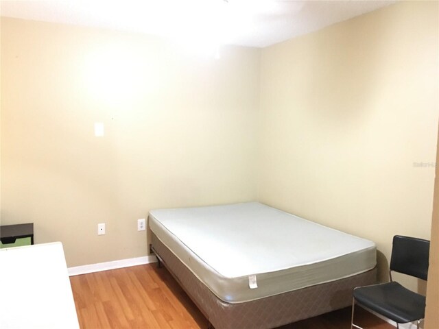 bedroom with light wood-type flooring