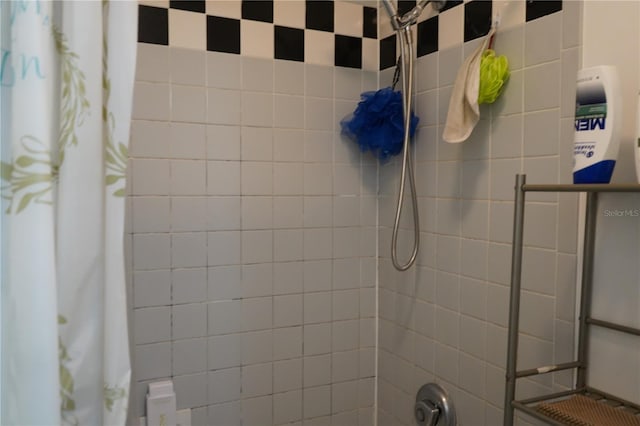 bathroom with a shower with shower curtain