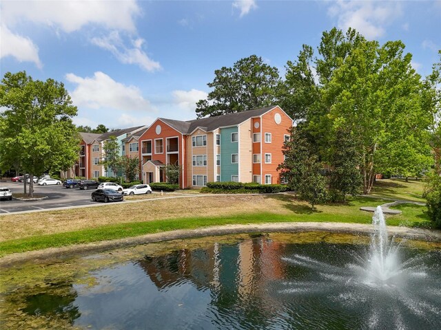 surrounding community featuring a water view