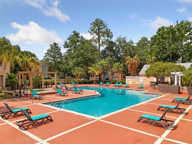 view of swimming pool with a patio area