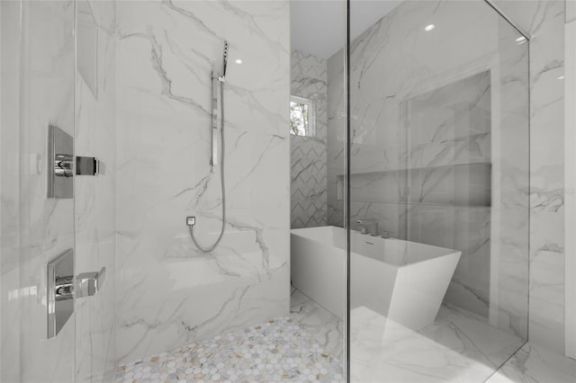 bathroom with shower with separate bathtub