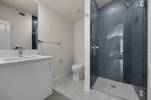 bathroom featuring a shower with door, vanity, and toilet