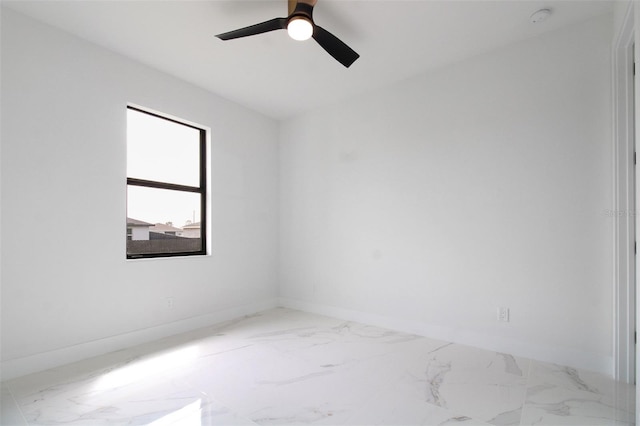 tiled empty room with ceiling fan