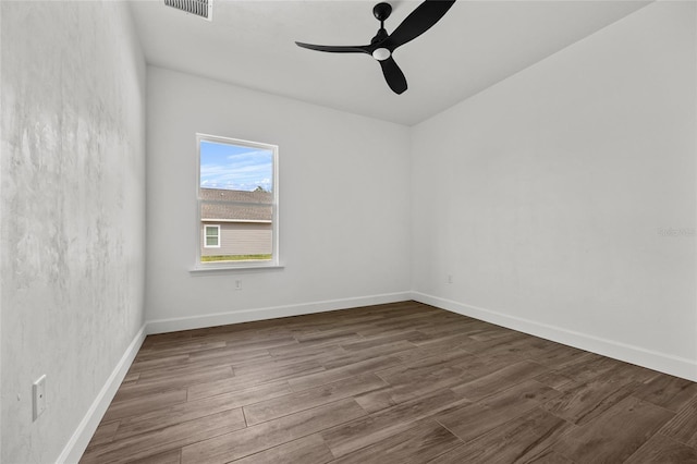 unfurnished room with ceiling fan and hardwood / wood-style flooring