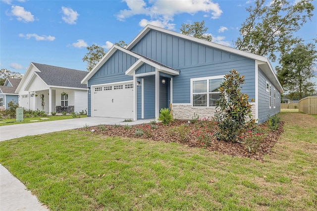 craftsman house featuring a garage and a front yard