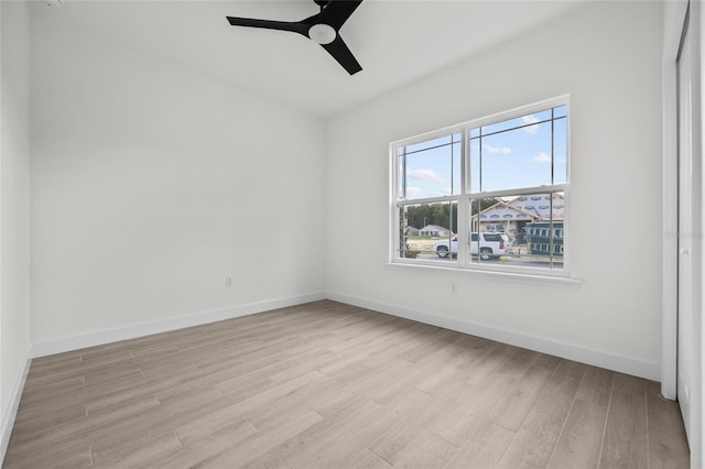 spare room featuring ceiling fan and light hardwood / wood-style flooring