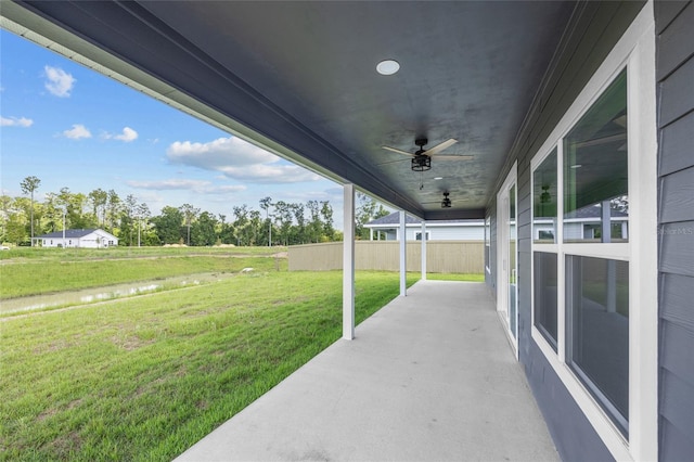 view of patio featuring ceiling fan