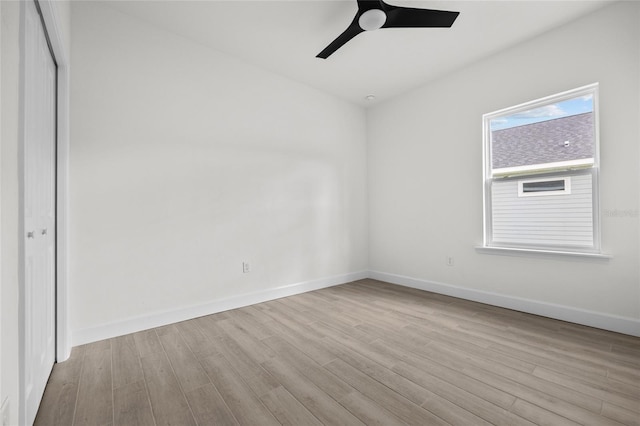 unfurnished bedroom with ceiling fan, light hardwood / wood-style floors, and a closet