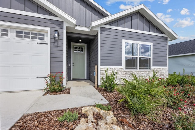 view of exterior entry featuring a garage