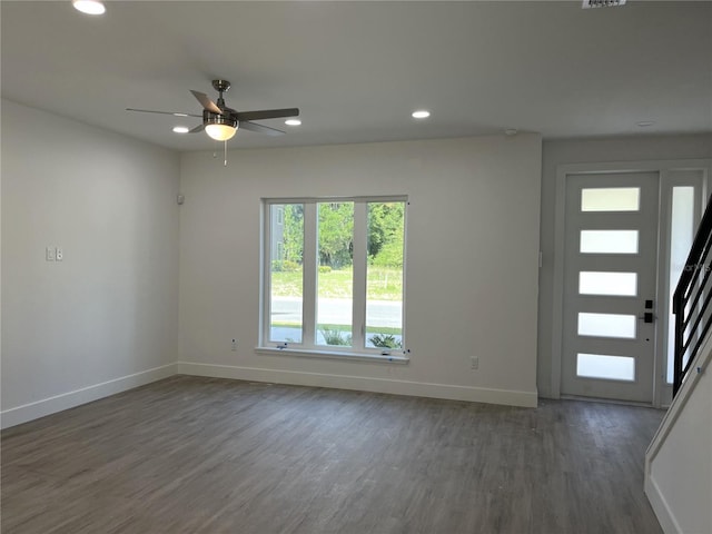 entrance foyer featuring ceiling fan and dark wood-type flooring