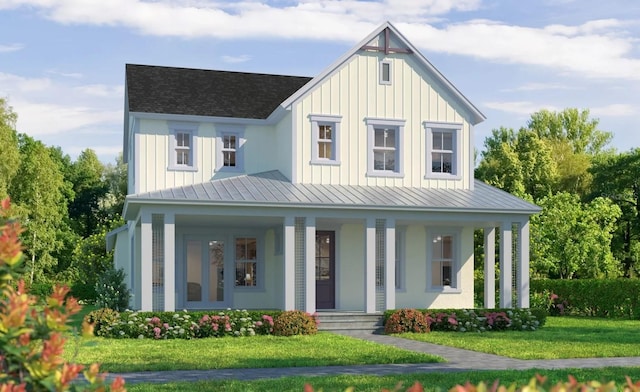 rear view of property with covered porch and a yard