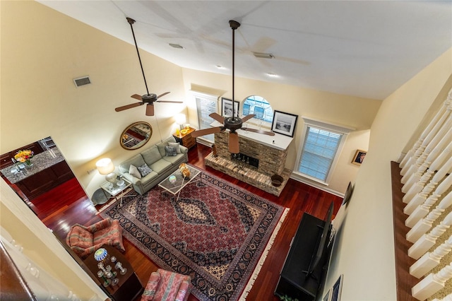 living room featuring high vaulted ceiling, wood-type flooring, and ceiling fan