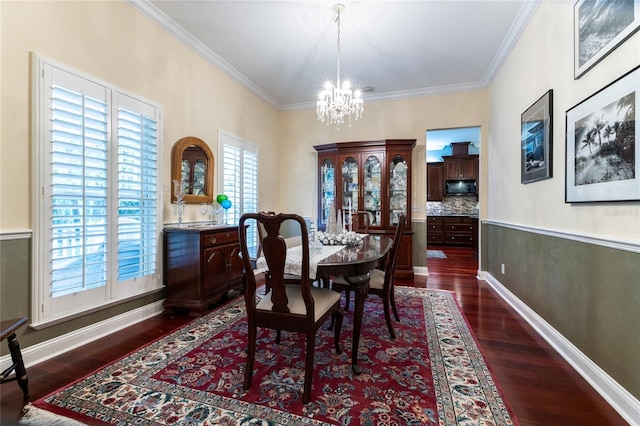 dining space with plenty of natural light, ornamental molding, and dark wood-type flooring