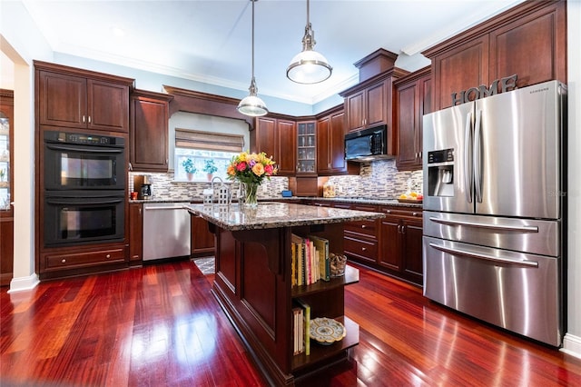 kitchen featuring a kitchen island, tasteful backsplash, black appliances, and dark wood-type flooring