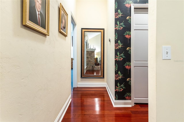 hall with wood-type flooring