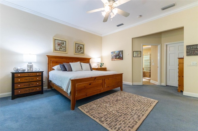 carpeted bedroom with ceiling fan, ensuite bathroom, and ornamental molding