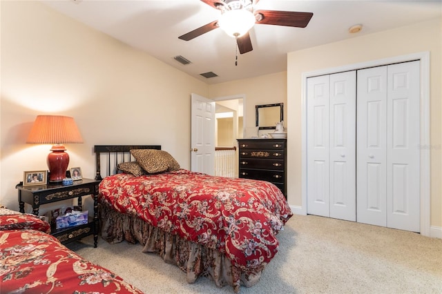 bedroom featuring a closet, ceiling fan, and carpet floors