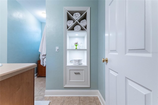 bathroom featuring tile floors and vanity