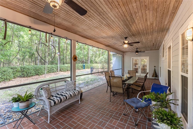 sunroom with wooden ceiling, french doors, and ceiling fan