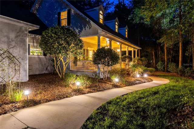 7108 NW 41st Ln, Gainesville, FL 32606 - property exterior at night with covered porch