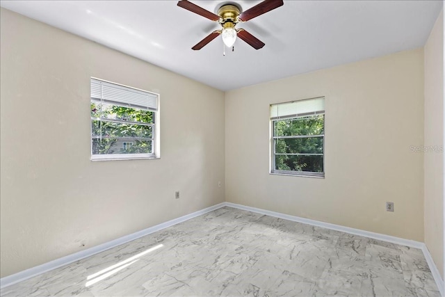 tiled empty room with ceiling fan