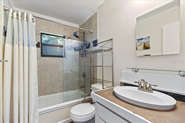 full bathroom with shower / bath combo, toilet, and vanity with extensive cabinet space