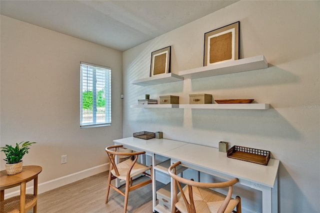 office area with light hardwood / wood-style flooring