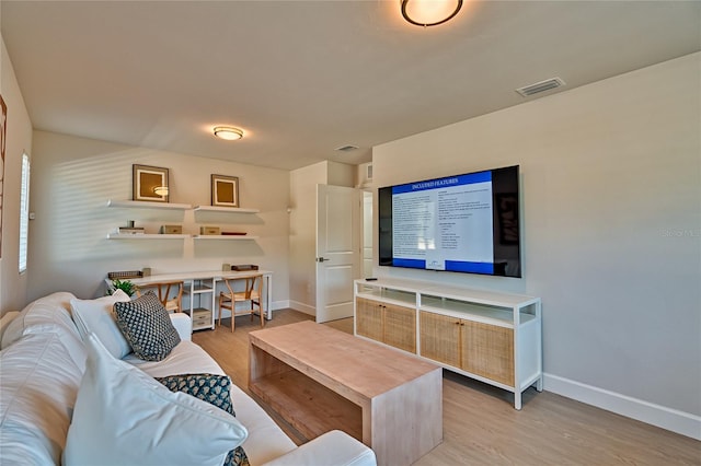 living room with light hardwood / wood-style flooring