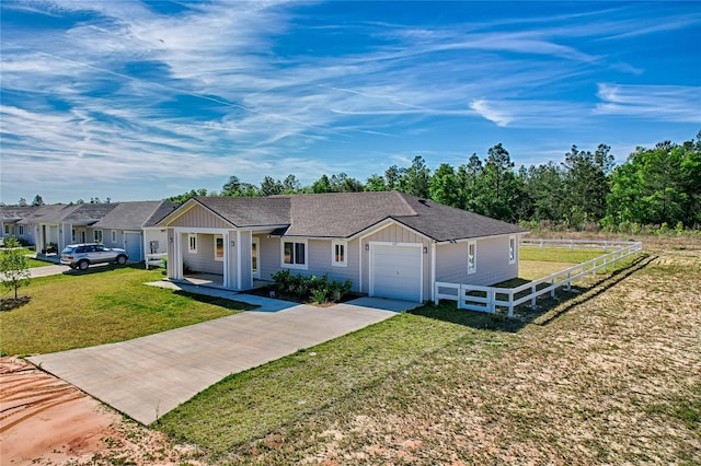 single story home with a front yard and a garage