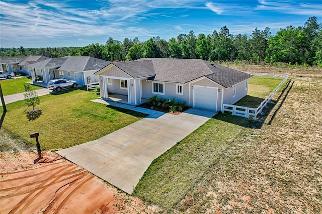 ranch-style home featuring a front yard and a garage