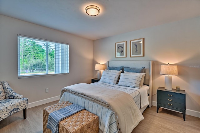 bedroom with light wood-type flooring