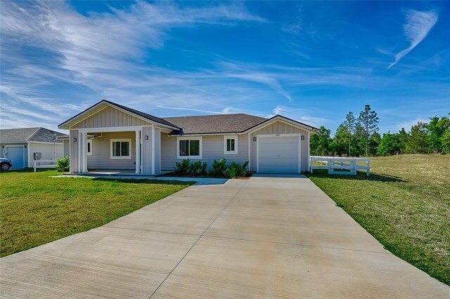 ranch-style home with a front yard and a garage