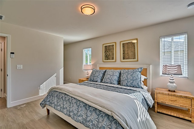 bedroom with light wood-type flooring