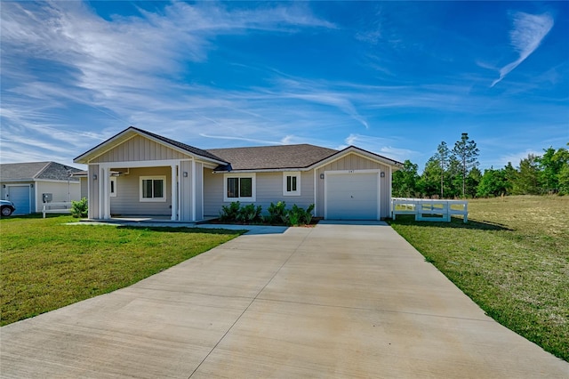 ranch-style house featuring a front lawn and a garage