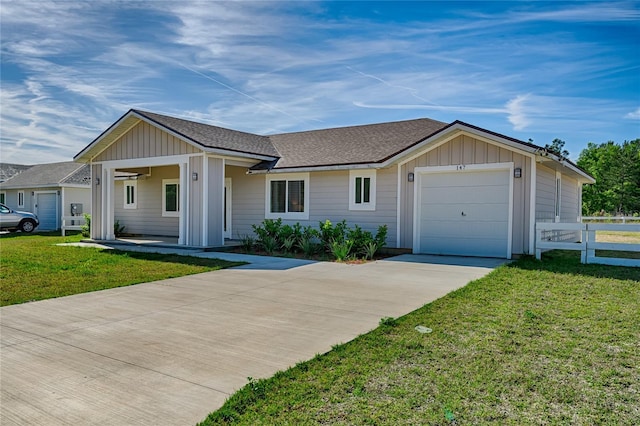 ranch-style home featuring a front yard and a garage