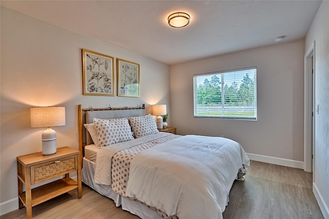 bedroom with light hardwood / wood-style flooring