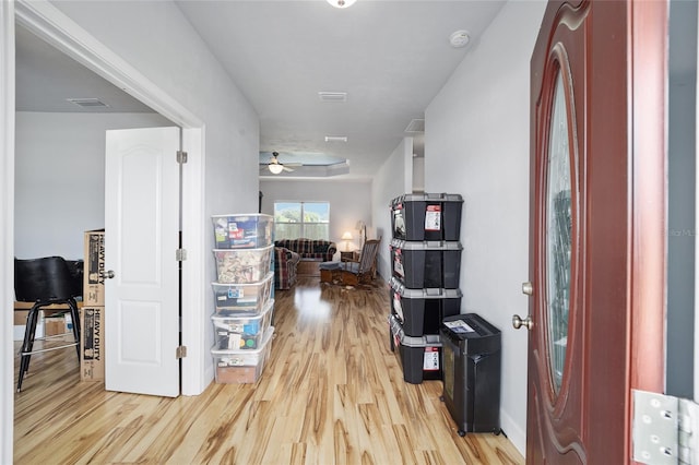 hallway with light hardwood / wood-style flooring