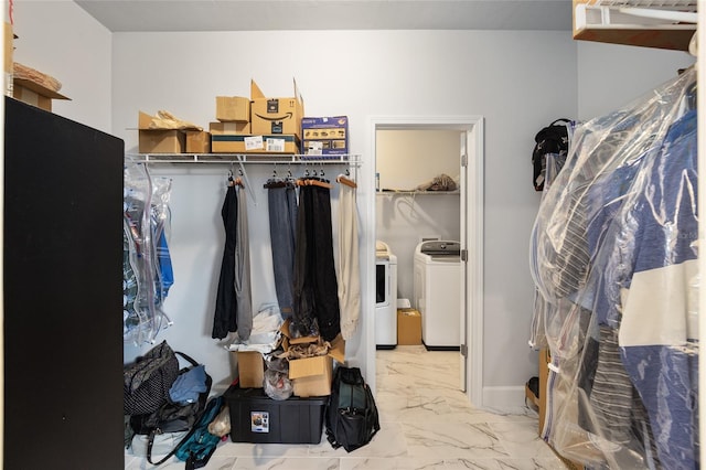 spacious closet featuring washing machine and clothes dryer