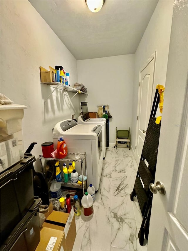 laundry room with washer hookup, light tile flooring, and washer and clothes dryer