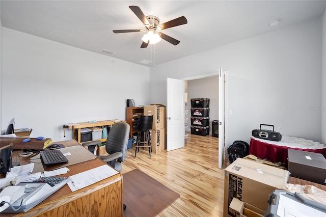 office space featuring ceiling fan and light hardwood / wood-style floors